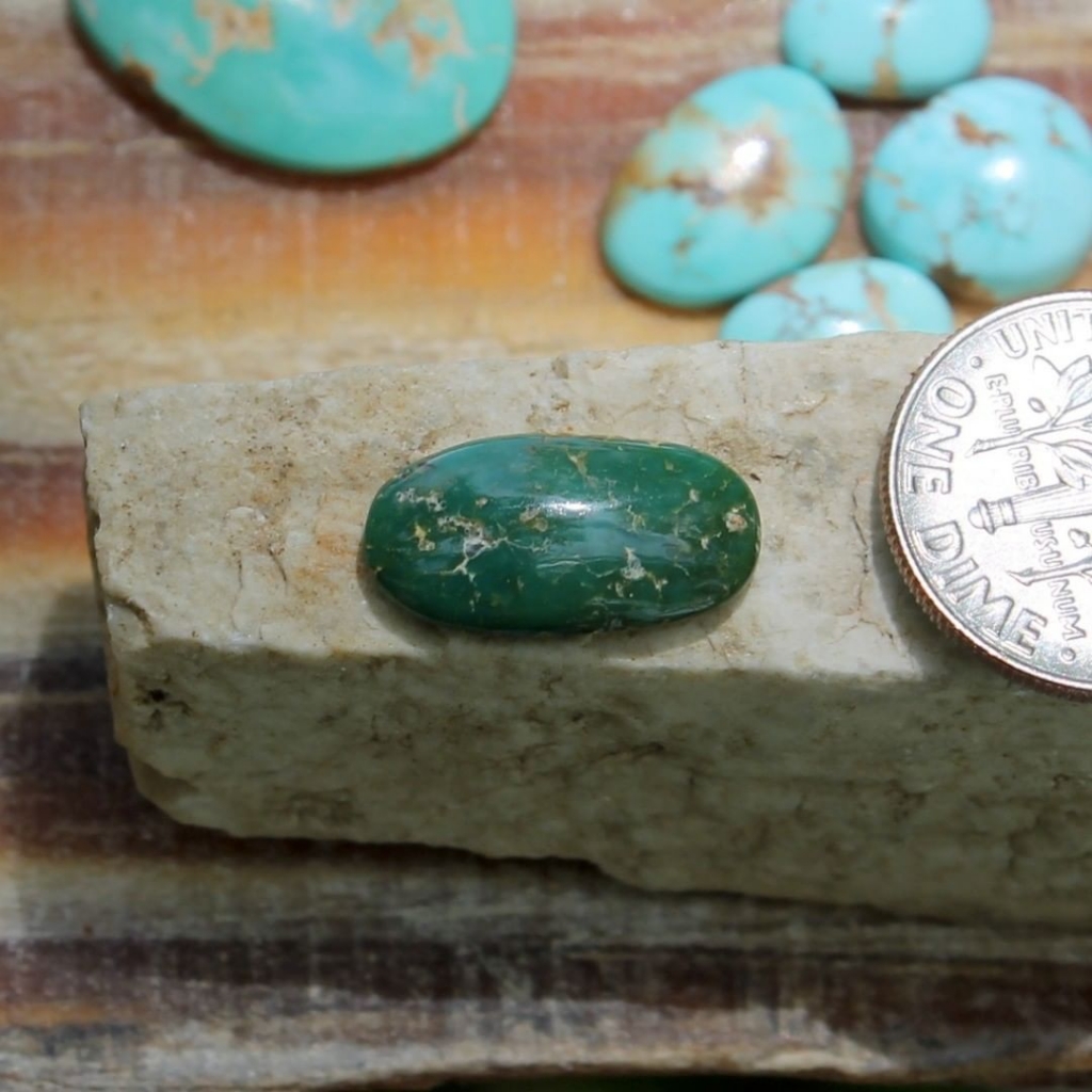 a-natural-dark-green-turquoise-cabochon-oval-stone-mountain-turquoise